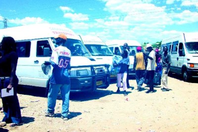 Passengers boarding a bus in Windhoek.