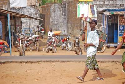 A boy vends his wares in a Monrovia community.