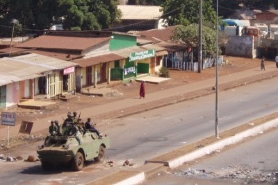 Armed soldiers crush protests in Guinea in February 2007.