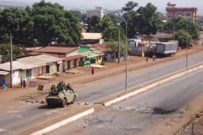 Armed soldiers crush protests in Guinea in February 2007.