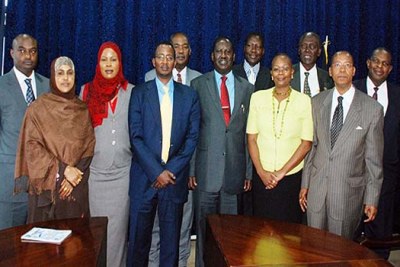 Kenya's PM Raila Odinga with members of the Independent Interim  Electoral Commission (IIEC).