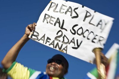 A fan exhorts his team at a match between Bafana Bafana, South Africa's national football squad, and Equatorial Guinea