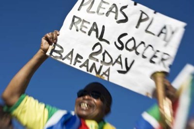 A South African fan exhorts his team
