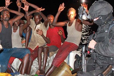A group of Somali pirates (file photo): Security officials speculate the kidnappers may be pirates with financial ties to Al Shabaab.