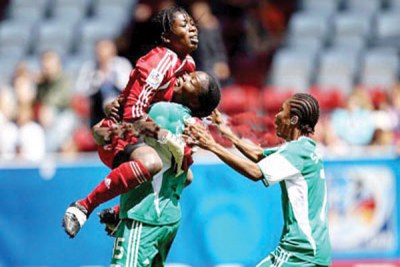 Alaba Jonathan, Joy Jegede and Esther Sunday of Nigeria celebrate after winning the FIFA U20 Womens World Cup Quarter Final match against USA on July 25, 2010 in Augsburg, Germany.