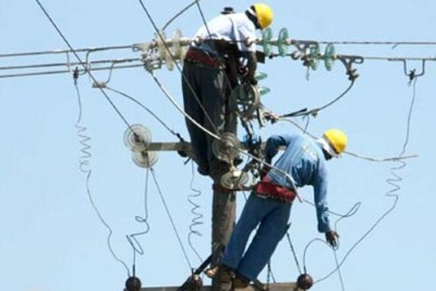 Workers installing transformers.