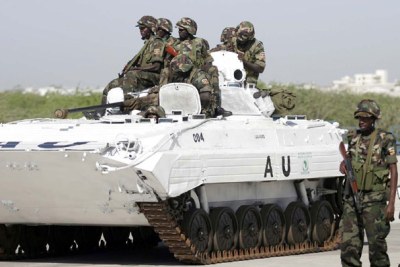 Some of the AMISOM troops atop a tank in Mogadishu.