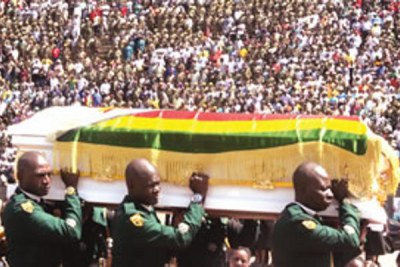 Pallbearers carry a casket at the National Heroes Acre (file photo).