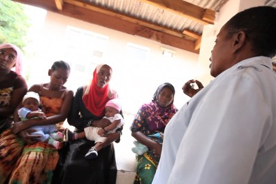 Tanzanian health workers talking to local communities (file photo).