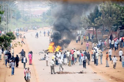 Protesters burn used tires in the middle of Entebbe road.