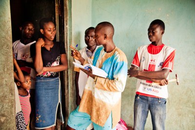A Red Cross bed net distribution team checks households to record the number of people in each household and the number of sleeping places (file photo).