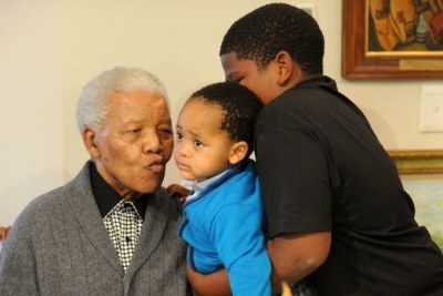 Madiba kisses his great-grandson