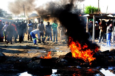 File photo: Striking miners erect burning barricades.