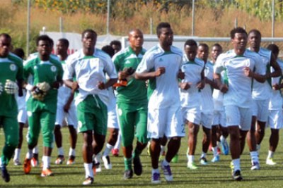 Super Eagles players loosening up before training.