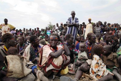 People displaced by clashes in South Sudans Jonglei state wait for a food distribution in Pibor.