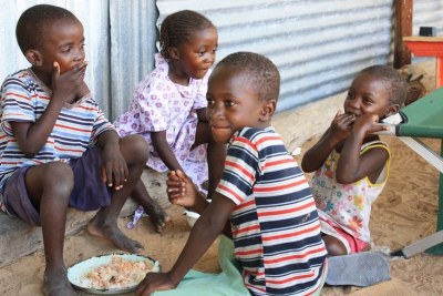 Children in the Haukongo household share their food.