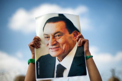 A supporter holds a poster of Egyptian former President Hosni Mubarak (file photo).