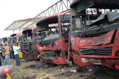 Burnt-out busses after an attack at a bus station packed with morning commuters in Abuja