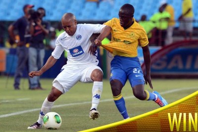 Sundowns player fights for the ball against Super Sport United.