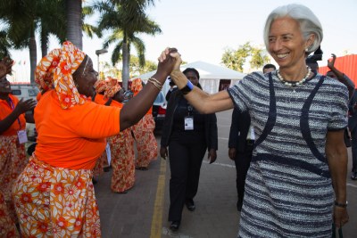 International Monetary Fund Managing Director Christine Lagarde is greeted by local singers (file photo).