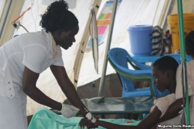 A nurse at a Doctors Without Borders cholera treatment center in Gudele.