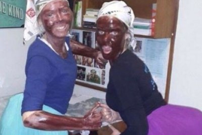 South African students face disciplinary action after taking photographs of themselves with blacked-up faces and pillows shoved in their skirts.