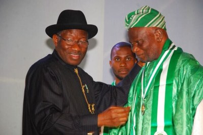 President Goodluck Jonathan and Michael Akinkunmi, the designer of the Nigerian flag.