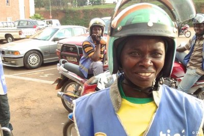 Motorcycle taxis are the main mode of transportation in Rwanda's capital, Kigali - Claudine Nyanamajambere is the only woman to drive a 