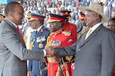 President Uhuru Kenyatta greets Ugandan President Yoweri Museveni, who attended the Madaraka Day celebrations, and advised Kenya to identify the culprits behind the Al-Shabaab attacks and deal with them.