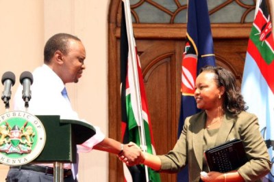 President Uhuru Kenyatta and Devolution Cabinet Secretary Anne Waiguru (file photo).