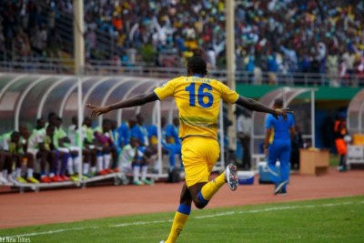 Rwanda star Sugira wheels away to celebrate his goal.