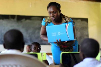 Ms Caroline Minayo, class one teacher at Butere Primary School in Kakamega County, introduces her pupils to digital tablets on May 3, 2016.