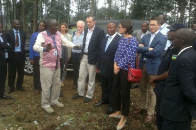 Justin Gatsinzi, the representative of VUP in Musanze District, shares insights about the programme with Minister Wharton (in black jacket), Northern Province Governor, Aime Bosenibamwe, DFID Country Head Laure Bonfils, and UK High Commissioner to Rwanda William Gelling, among other officials.
