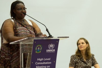Disaster Management and Refugee Affairs minister Saraphine Mukantabana (L) speaks during the meeting as Princess Sarah Zeid of Jordan looks on.