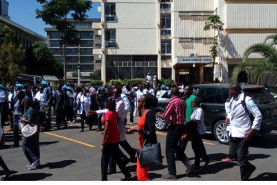 Kenya Medical Practitioners, Pharmacists and Dentists Union members walk out of the Milimani Commercial Court in Nairobi.