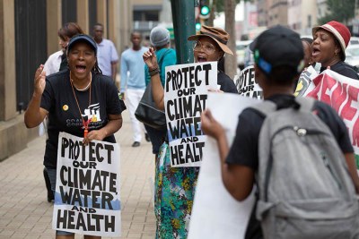 Activists demonstrate outside the court during the hearing on the Thabametsi coal-fired power station.