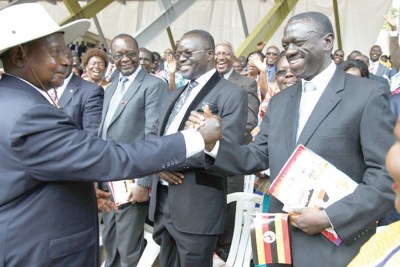 President Museveni with former FDC presidential candidate Kizza Besigye (file photo).
