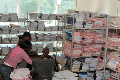 Hard copy documents in an office. Storing records electronically enables one to manage records easily.