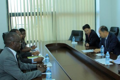 Uganda's ministry of foreign affairs officials led by the permanent secretary Patrick Mugoya (L) meet with Chinese Diplomats.