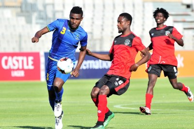 Banda Abdi of Tanzania challenged by Jabulani Linje of Malawi during the Cosafa Castle Cup match between Tanzania and Malawi at the Moruleng Stadium in Rustenburg on 25 June 2017.