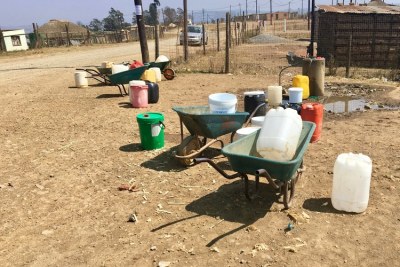 Containers are left standing as residents of Ezinketheni in Pietermaritzburg wait for water to return to the one functioning tap (file photo).
