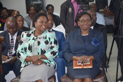 Lands minister Betty Amongi, left, with Lady Justice Catherine Bamugemereire during the launch of the inquiry earlier this year.