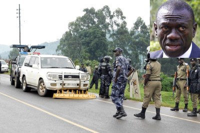 Police officers block Kizza Besigye's car shortly after he was intercepted on his way to Kabale on October 19, 2017. Inset is Dr Besigye.