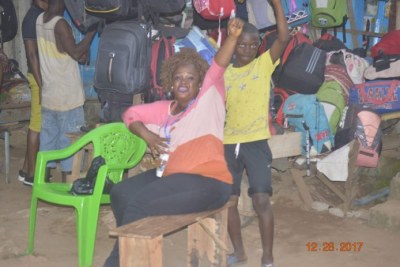 A CDC supporter shows her joy at George Weah's victory in Liberia.