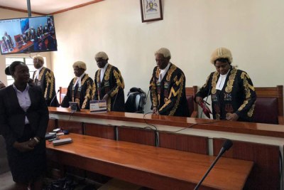 The judges take their seats before reading of the verdict at Mbale High Court on July 26, 2018 (file photo).