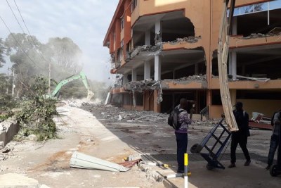 A bulldozer brings down South End Mall on Langata Road on August 8, 2018.