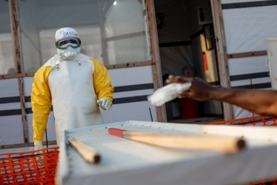 MSF medical staff in protective gear on a shift in the high-risk zone to check people with suspected cases of Ebola (file photo).