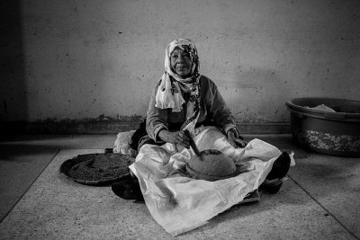 A Moroccan woman producing Argan Oil.