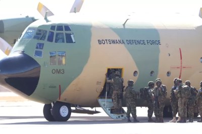 Soldiers board a Botswana Defence Force plane to Mozambique.