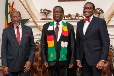 Former President of Mozambique Joaquim Chissano, left, with Zimbabwe's President Emmerson Mnangagwa and African Development Bank President Akinwumi Adesina.